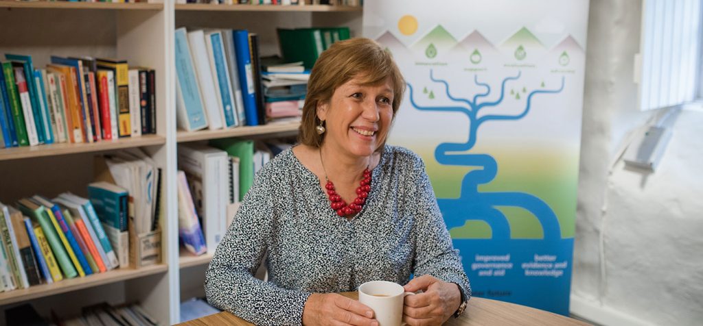 Dorcas sat at her desk