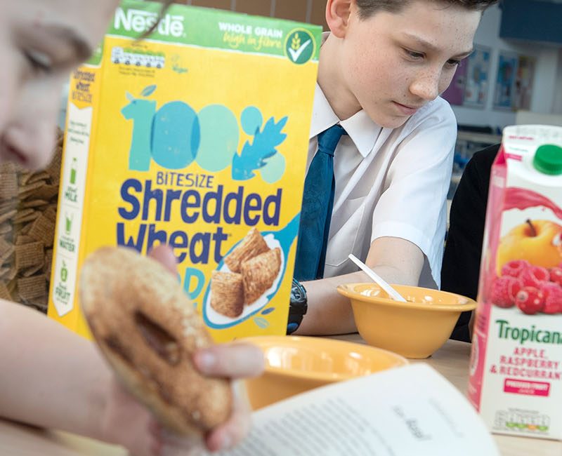 Group of students enjoy breakfast