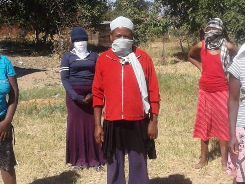 Group of African women with face coverings