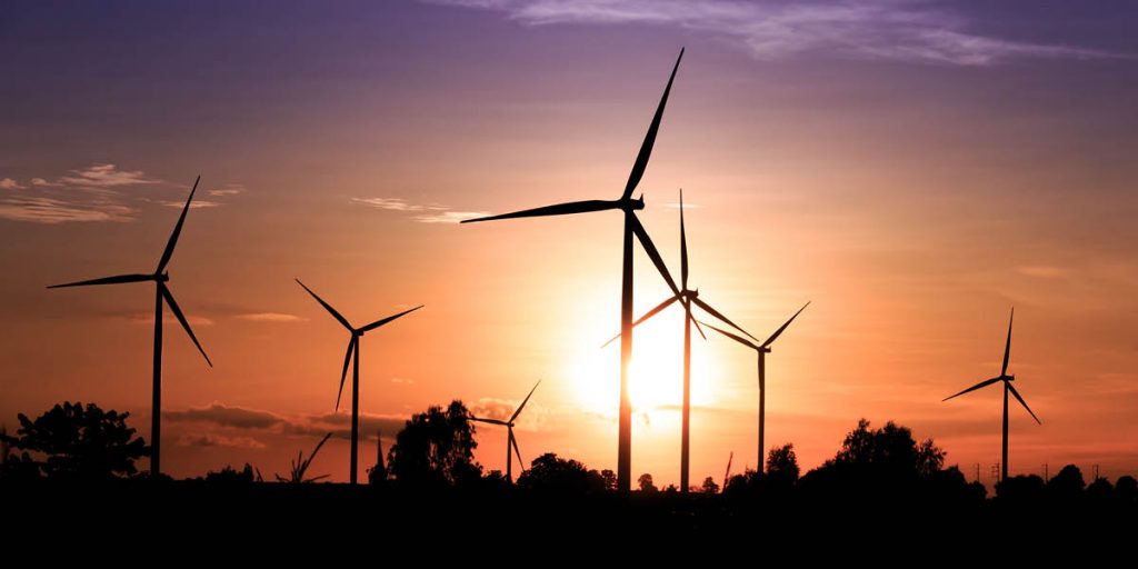 Sunsetting behing wind turbines