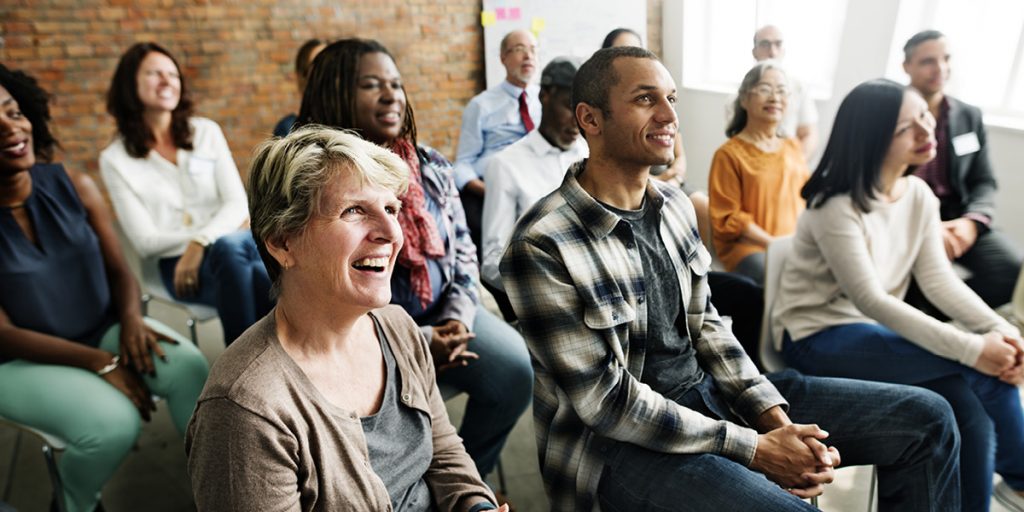 Group of people listening at summit