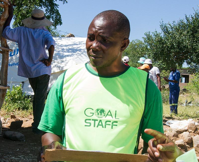 GOAL worker speaking to those in need