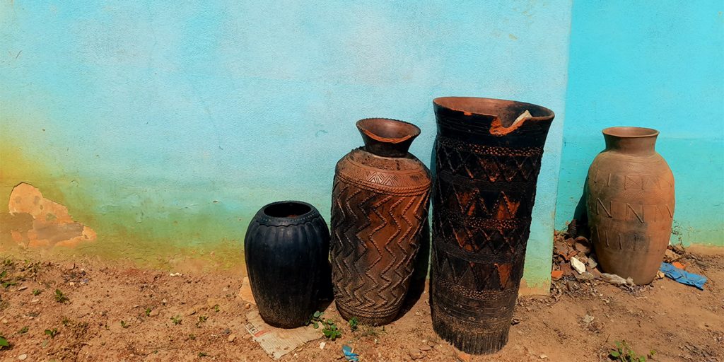 Ceramic pots in front of a blue wall