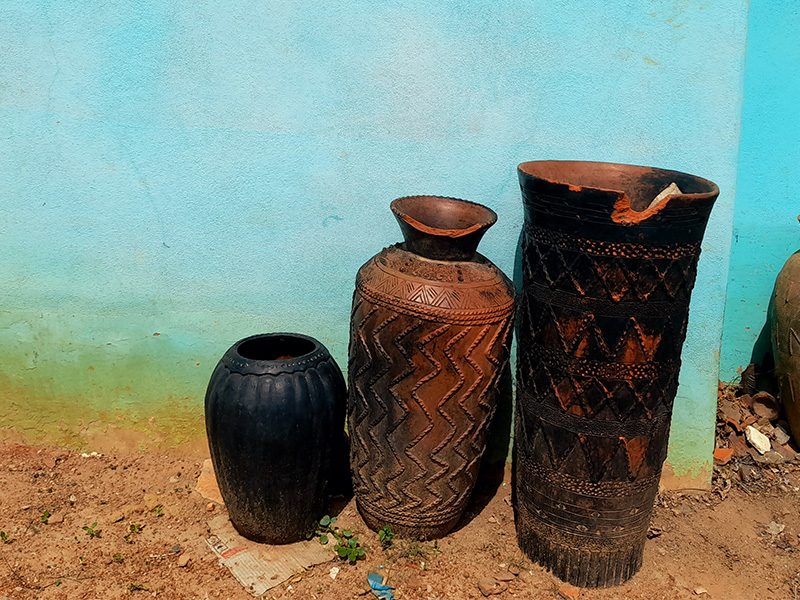 Ceramic pots in front of a blue wall