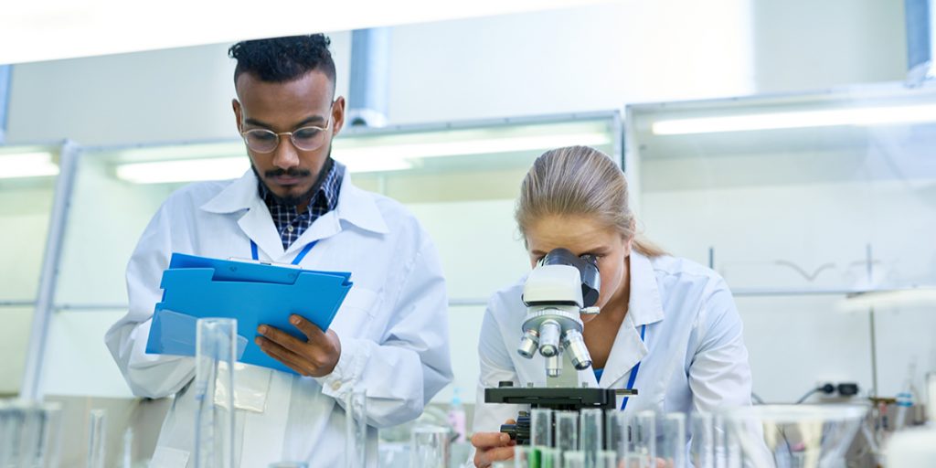 Two young scientists investigating