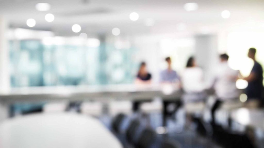 Soft focus photo of team meeting in boardroom