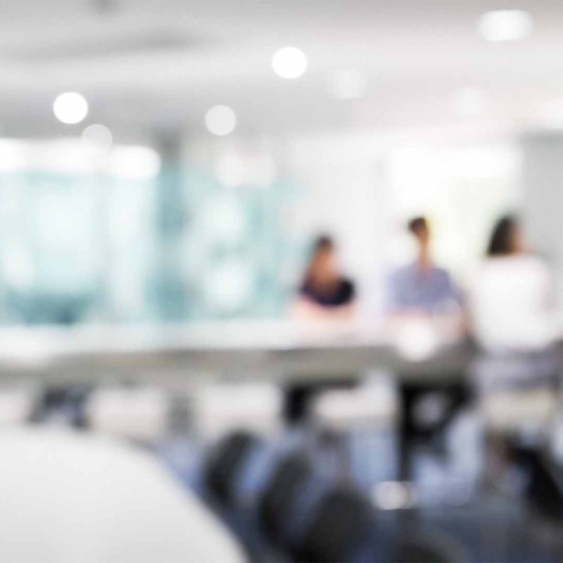 Soft focus photo of team meeting in boardroom