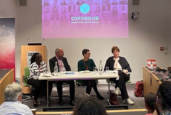 Panelists speaking at Interim event