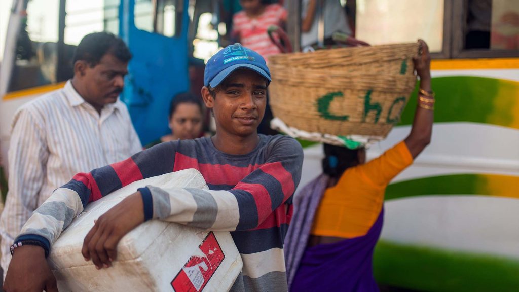 Young Indian boy collecting humanitarian aid