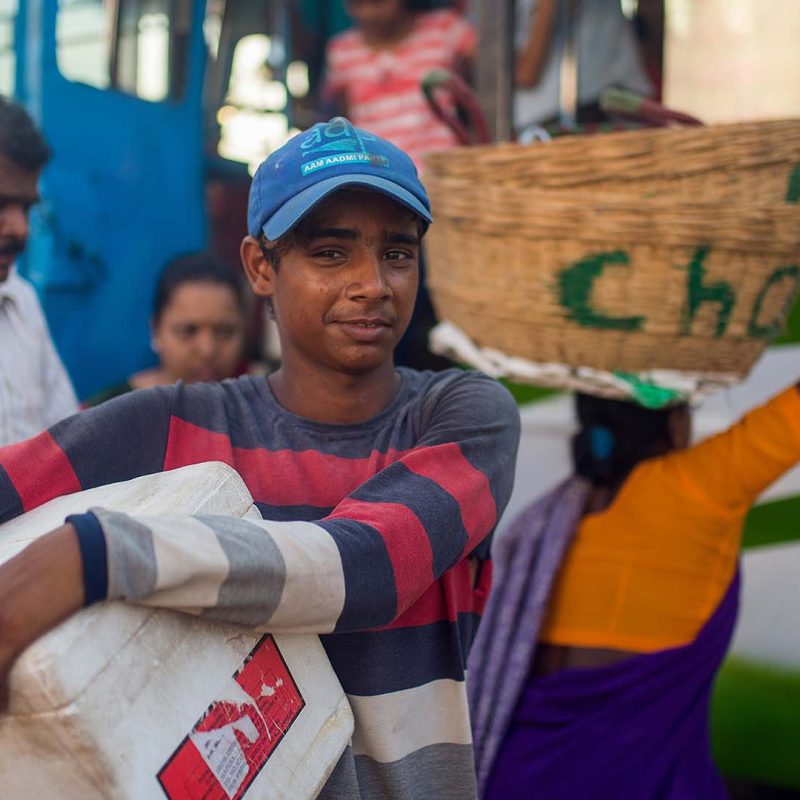 Young Indian boy collecting humanitarian aid