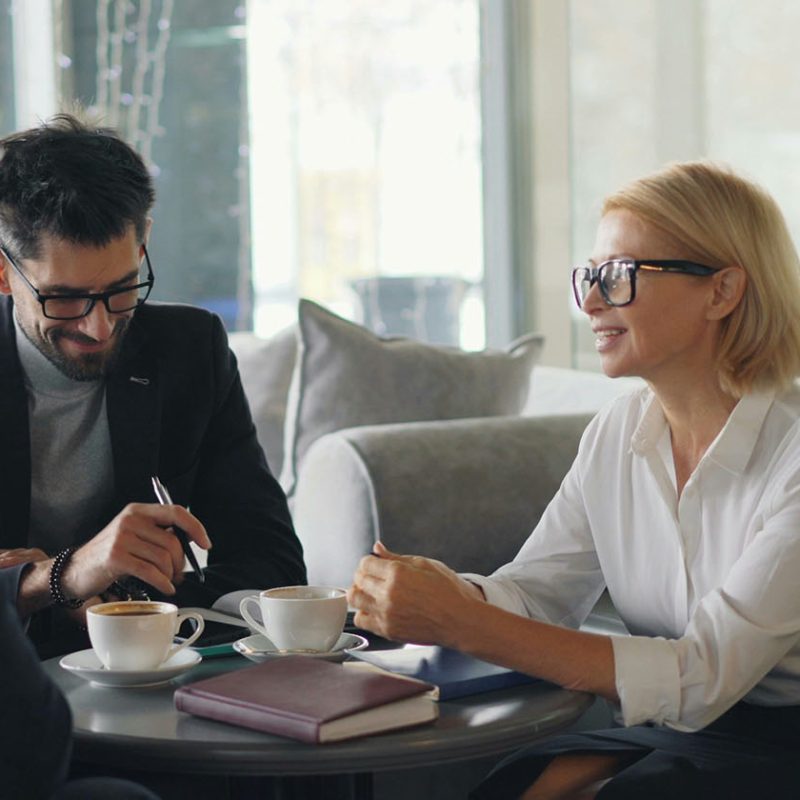 Three senior leaders in meeting