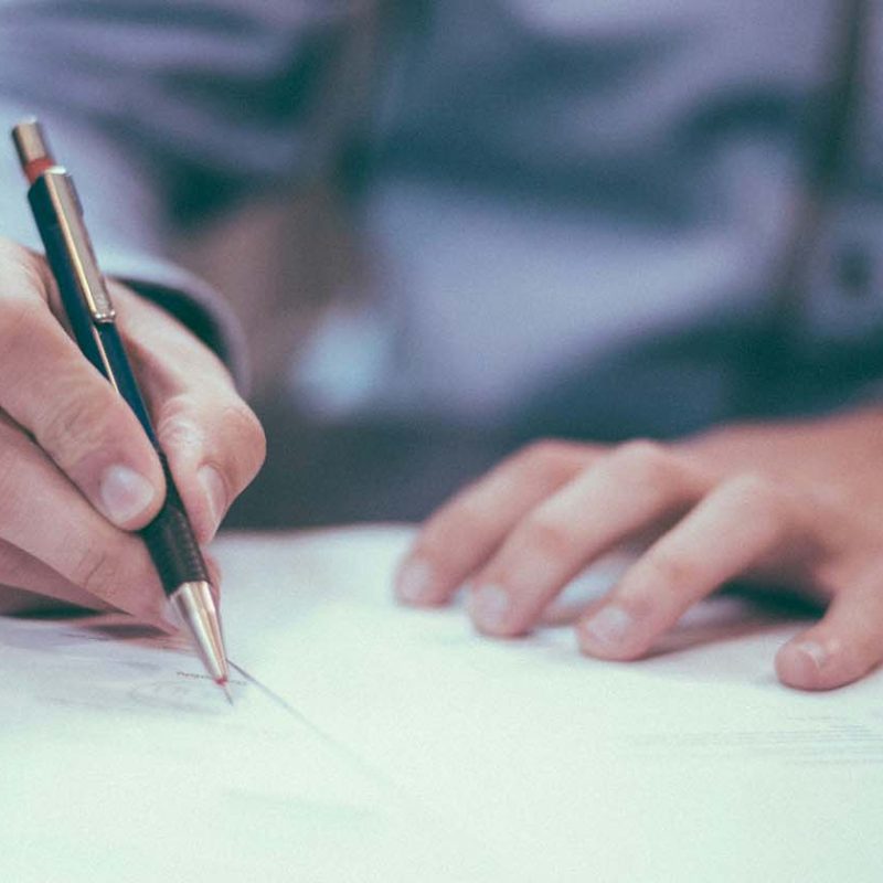 Man filling out assessment form