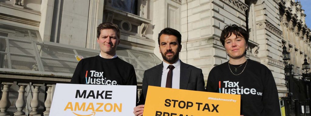 Activists from Tax Justice UK protesting on the streets of London