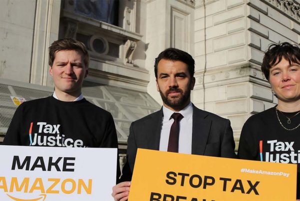Activists from Tax Justice UK protesting on the streets of London